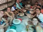 students with plates in foreign country