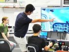teacher pointing at board